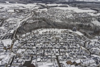 Aerial view of the snowy winter landscape of Winterberg with deserted streets during the Corona