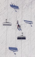 Skiers on ski slope and chairlift, Winterberg, Sauerland, North Rhine-Westphalia, Germany, DE,