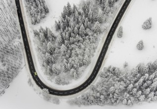 Aerial view of the snowy winter landscape of Winterberg with winding roads and paths in the