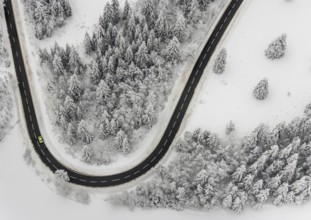Aerial view of the snowy winter landscape of Winterberg with winding roads and paths in the