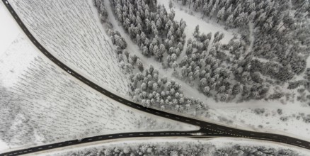 Aerial view of the snowy winter landscape of Winterberg with winding roads and paths with a