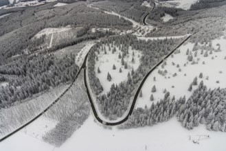 Aerial view of the snowy winter landscape of Winterberg with winding roads and paths in the