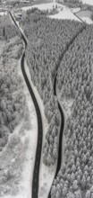 Aerial view of the snowy winter landscape of Winterberg with winding roads and paths in the