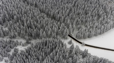 Aerial view of the snowy winter landscape of Winterberg with winding roads and paths in the