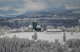 Aerial view of the snowy winter landscape of Winterberg am Kahlen Asten with Astenturm in times of