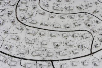 Aerial view of the snowy winter landscape of Winterberg with the deserted Landal Winterberg holiday