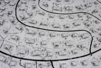 Aerial view of the snowy winter landscape of Winterberg with the deserted Landal Winterberg holiday