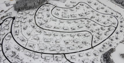 Aerial view of the snowy winter landscape of Winterberg with the deserted Landal Winterberg holiday