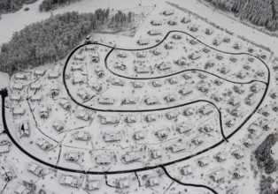 Aerial view of the snowy winter landscape of Winterberg with the deserted Landal Winterberg holiday