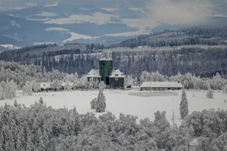Aerial view of the snowy winter landscape of Winterberg am Kahlen Asten with Astenturm in times of