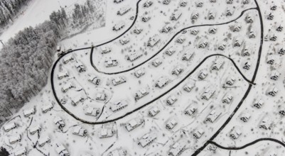 Aerial view of the snowy winter landscape of Winterberg with the deserted Landal Winterberg holiday