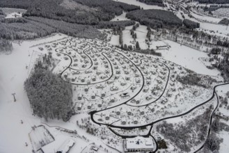 Aerial view of the snowy winter landscape of Winterberg with the deserted Landal Winterberg holiday