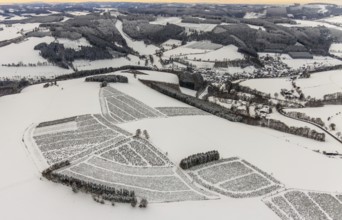 Aerial view of the snowy winter landscape of Winterberg in Sauerland in North Rhine-Westphalia,
