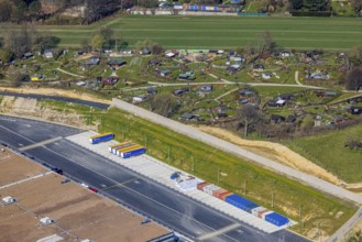 Aerial view, allotment garden site Mellmausland next to the Amazon site on the industrial estate on