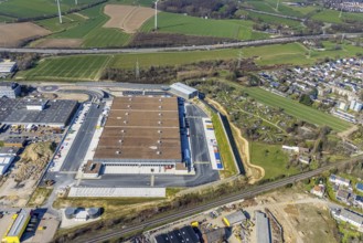 Aerial view, construction site new building Amazon logistics centre, industrial estate on