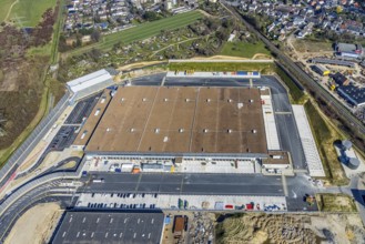 Aerial view, construction site new building Amazon logistics centre, industrial estate on