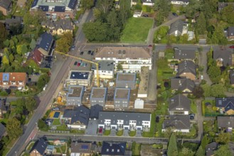 Aerial view, construction site with new construction of residential buildings on the site of the