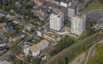 Aerial view, high-rise housing estate and construction site with new building for a retirement home