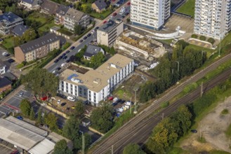 Aerial view, high-rise housing estate and construction site with new building for a retirement home