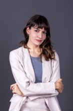 Elegant professional businesswoman with her arms crossed