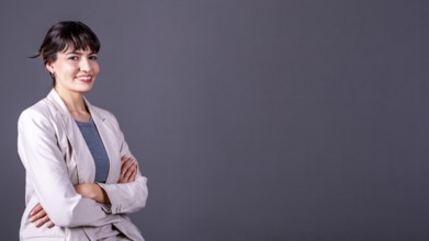 Elegant professional businesswoman with her arms crossed