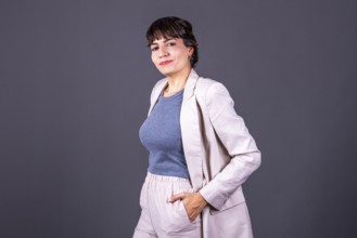 Elegant young businesswoman with her hand in her pocket