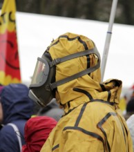 Man in protective clothing at anti-nuclear demonstration