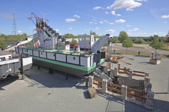 Historic dredging ship 'Otter' with shovels for dredging, open-air museum, machine, view from