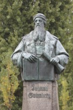 Monument to Johannes Gutenberg with book, scroll, inscription, bronze sculpture, Gutenberg