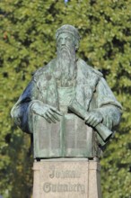 Monument to Johannes Gutenberg with book and scroll, bronze sculpture, inscription, Gutenberg