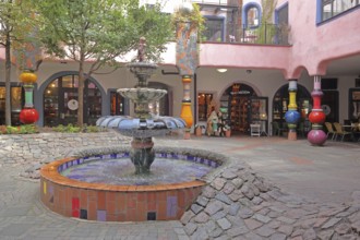 Inner courtyard with fountain and colourful columns, Green Citadel, Hundertwasser House, Magdeburg,