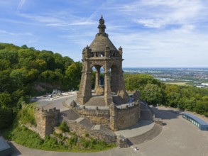 A monumental building on a hill, surrounded by trees and a sweeping view, aerial view, Kaiser