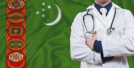 Male doctor with stethoscope on Turkmen flag. Doctor holding stethoscope on Turkmenistan flag