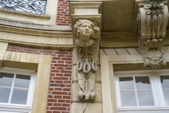 Traditional Westphalian Mettwurst sausage, detail on the facade of the Erbdrostenhof building,