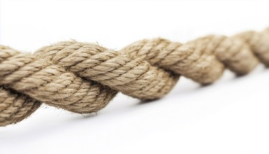 Detailed Close-Up Shot Of A Taut Rope Against A White Background Showing Strain And Pressure. High