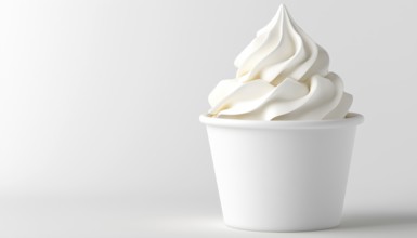 Delicious Whipped Cream Or Soft Ice Cream Served In A Classic White Cup, Perfect For Indulging In