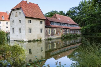 Water reflection, Senden Castle, Senden, North Rhine-Westphalia, Germany