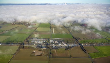 Aerial view, fog over Büderich and Holtum as well as construction site and extension of the