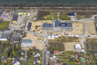 Aerial view, construction site and new building in the Friedrichsfeld industrial estate,