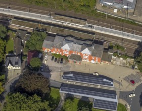 Aerial view, Schwelm railway station with red station building and bus station with solar roof in