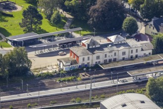 Aerial view, Schwelm railway station with red station building and bus station with solar roof in