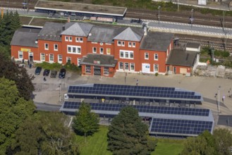 Aerial view, Schwelm railway station with red station building and bus station with solar roof in