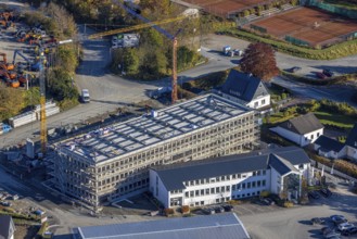 Aerial view, construction site with new building on the premises of the Feldhaus Group in the