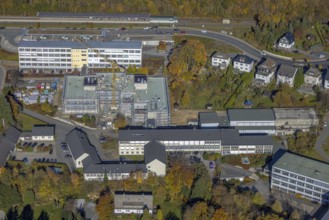 Aerial view, bus station and construction work at the vocational college Olsberg of the HSK in