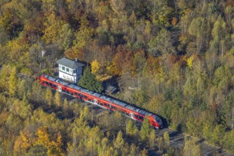 Aerial view, S-Bahn at a guard house in autumn forest in the district of Bigge in Olsberg,