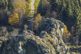 Aerial view, autumn forest and Bruchhauser Steine with summit cross in the district Bruchhausen in