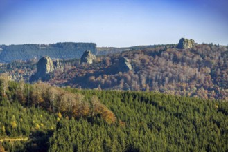 Aerial view, autumn forest and Bruchhauser Steine with summit cross in the district Bruchhausen in