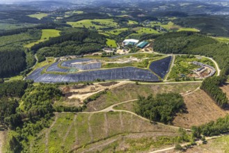 Aerial view, forest area with forest damage and clear cutting, area covered with plastic tarpaulins