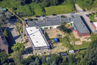 Aerial view, construction site and new building at the municip. Day care centre Holten in