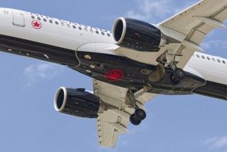 Passenger plane with deployed landing gear, Montreal, Province of Quebec, Canada